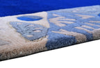 Handgeknüpfter Tibeter Teppich in blau mit Retro-Bordüre – Neuwertig