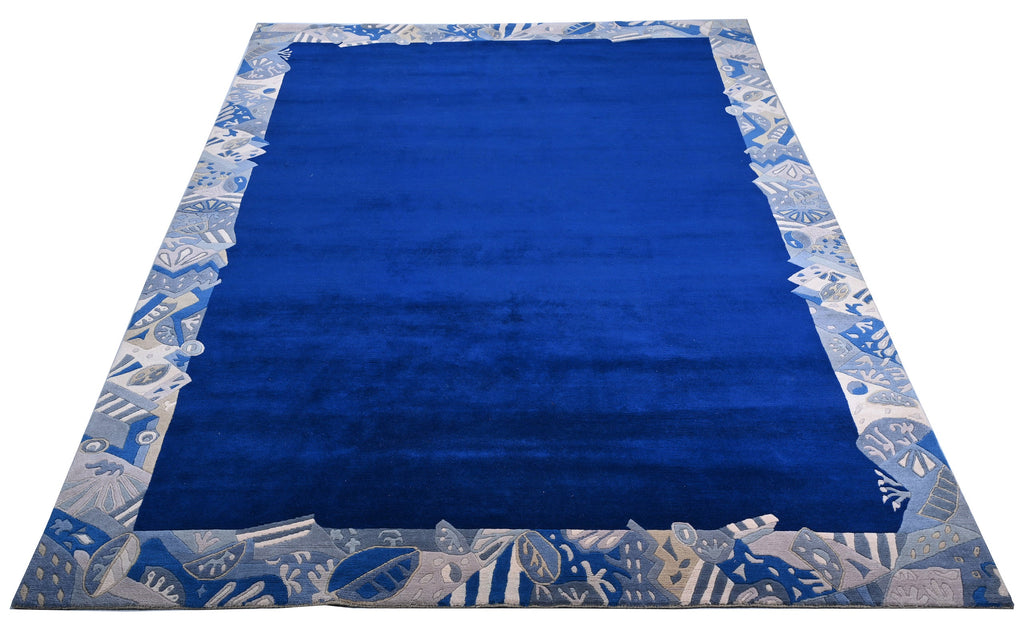 Handgeknüpfter Tibeter Teppich in blau mit Retro-Bordüre – Neuwertig