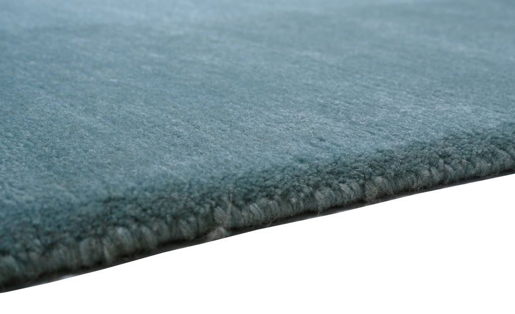 Handgeknüpfter Tibeter Teppich in grün mit Retro Bordüre – Neuwertig