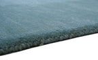 Handgeknüpfter Tibeter Teppich in grün mit Retro Bordüre – Neuwertig