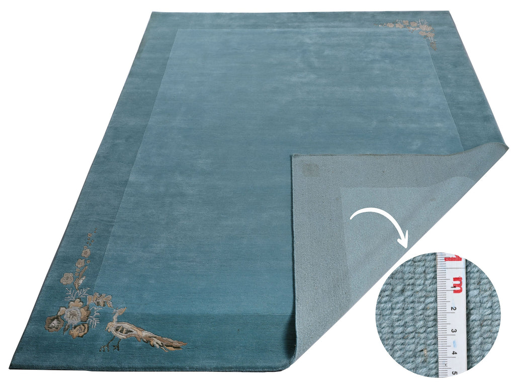 Handgeknüpfter Tibeter Teppich in grün mit Retro Bordüre – Neuwertig
