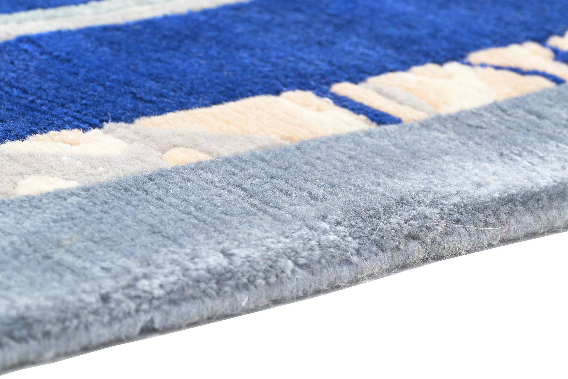 Handgeknüpfter Tibeter Teppich in blau mit Retro-Bordüre – Neuwertig
