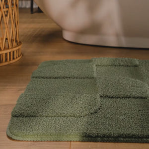 {"class" => "product-thumbnails__image", "alt" => "Badteppich von BathKing by WECONhome Davie Kiefer Grün Video Nahaufnahme von Flor und Kante, Hand bewegt den Teppich und zeigt Materialstruktur"}